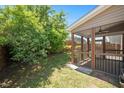 Backyard featuring lush lawn and a screened porch at 3566 Sunbright Ln, Raleigh, NC 27610