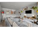 Bright living room featuring a sectional sofa, TV, and stylish decor at 500 Umstead Dr # 103C, Chapel Hill, NC 27516