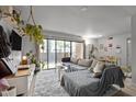 Comfortable living room featuring a large sectional sofa and sliding glass doors to the outside at 500 Umstead Dr # 103C, Chapel Hill, NC 27516