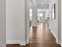 Hallway featuring hardwood floors and views into other rooms in the house at 108 Valley View Dr, Chapel Hill, NC 27516