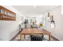 Bright eat-in kitchen features a granite breakfast bar, modern appliances, and a dining area at 154 Holmes Corner Dr, Smithfield, NC 27577