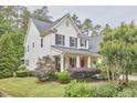 Charming two-story home with inviting front yard and well-manicured landscaping at 210 Bennington Pkwy, Durham, NC 27713