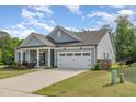 Beautiful single-story home with a two-car garage and well-maintained landscaping at 3034 Raddercrest Ct, Fuquay Varina, NC 27526