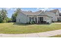 Well-maintained lawn and landscaping complement this attractive single-story home at 3034 Raddercrest Ct, Fuquay Varina, NC 27526