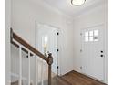 Bright entryway featuring hardwood floors, white walls, and a stairway at 50 Rosewood Ln, Youngsville, NC 27596