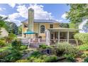 An inviting backyard deck and screened-in porch provide ample outdoor living space at 5417 Harrington Grove Dr, Raleigh, NC 27613