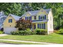 Attractive two-story home with colorful shrubbery and well maintained lawn at 5417 Harrington Grove Dr, Raleigh, NC 27613