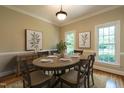 Formal dining room with elegant decor, perfect for hosting gatherings at 5812 N Beaver Ln, Raleigh, NC 27604