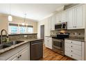 Well-equipped kitchen with stainless steel appliances and granite countertops at 5812 N Beaver Ln, Raleigh, NC 27604
