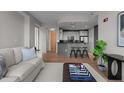 Bright living area with kitchen, hardwood floors and a comfortable seating area at 618 N Boylan Ave # 810, Raleigh, NC 27603