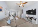 Bright living room with hardwood floors and a comfortable sectional sofa at 6612 Rossford Ln, Durham, NC 27713