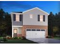 Charming two-story home with brick accents and a two-car garage at 833 Ottawa Dr, Garner, NC 27529