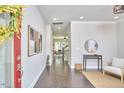 Bright foyer features hardwood floors, neutral walls, and an open view into the living spaces beyond at 120 Chapel Run Way, Chapel Hill, NC 27517