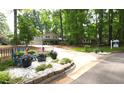 Traditional two-story home with a well-manicured lawn and driveway and beautifully landscaped frontage at 125 Amesbury Ln, Cary, NC 27511