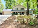 Traditional two-story home with a welcoming porch and well-maintained landscaping at 125 Amesbury Ln, Cary, NC 27511