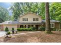 Charming two-story traditional home with a landscaped front yard and covered porch at 125 Amesbury Ln, Cary, NC 27511