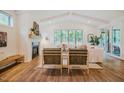 Bright living room with vaulted ceilings, fireplace, and sliding doors to the outdoor patio at 151 Monteith Dr, Chapel Hill, NC 27516