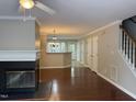 Spacious living room featuring a fireplace, hardwood floors, and an open floor plan at 210 Standish Dr Dr, Chapel Hill, NC 27517