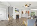 Inviting living room featuring a fireplace, hardwood floors, and an open layout at 223 Morgan Brook Way, Rolesville, NC 27571