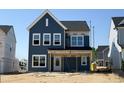 Inviting new construction home, boasting a classic exterior design, and awaiting landscaping at 261 Marvel Dr # 136, Rolesville, NC 27571