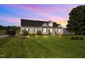 Well maintained single-story home featuring verdant lawn and manicured landscaping at 281 Derwin Dr, Timberlake, NC 27583