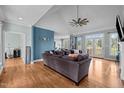 Bright and spacious living room features vaulted ceiling, hardwood floors, and neutral paint at 281 Derwin Dr, Timberlake, NC 27583