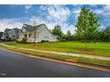 Well-manicured lawn and beautiful landscaping surrounding the attractive home in a Gathering-friendly neighborhood at 328 Boone St, Chapel Hill, NC 27516