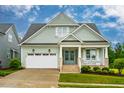 Charming two-story home with a welcoming front porch and manicured landscaping at 328 Boone St, Chapel Hill, NC 27516