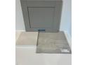 Sample of interior finishes featuring gray cabinet, white countertop, and light gray tile at 376 Chesapeak Commons St # 130, Garner, NC 27529