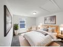 Comfortable main bedroom with a queen bed, neutral decor, and filled with natural light at 4169 Weavers Pond Dr, Zebulon, NC 27597