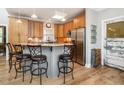 Eat-in kitchen featuring stainless steel appliances, granite counters, and an island with bar seating at 506 Wildwood Ln, Graham, NC 27253