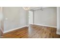 Spacious living room with wood floors, neutral walls, and modern lighting at 509 Olive Branch Rd, Durham, NC 27703