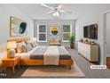 Bright main bedroom with neutral colors, natural light, a ceiling fan, and a spacious closet at 5612 Tealbrook Dr, Raleigh, NC 27610