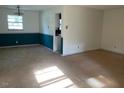 Open living area with large windows and space for multiple seating arrangements at 601 Crestview Dr, Durham, NC 27712