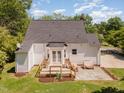 Aerial view showcasing a well-maintained backyard with a deck and patio area, offering private outdoor enjoyment at 6225 Jones Farm Rd, Wake Forest, NC 27587