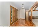 Inviting foyer with beautiful parquet floors and a light fixture, showcasing a warm welcome at 8409 Crowder Rd, Raleigh, NC 27603