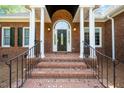 Elegant brick entrance with stately columns and a beautiful front door with sidelights at 8733 Crowder Rd, Raleigh, NC 27603