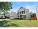 A view of a two-story house featuring a well-maintained lawn and driveway at 1005 Fulbright Dr, Morrisville, NC 27560
