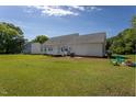 Spacious backyard offers ample space for outdoor activities and entertaining, featuring a small deck at 1009 Open Field Dr, Garner, NC 27529