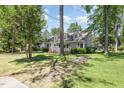 Charming two-story home with a landscaped front yard and dormer windows at 103 E Meadowbrook Dr, Smithfield, NC 27577