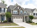 Well-maintained two-story home featuring a two-car garage, lovely landscaping, and inviting curb appeal at 1380 Channing Park Cir, Cary, NC 27519