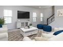Bright living room with large windows, neutral décor, and an open concept layout at 1380 Channing Park Cir, Cary, NC 27519