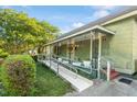 Inviting front porch featuring a ramp, decorative wrought iron, and comfortable outdoor space at 204 Heck St, Raleigh, NC 27601
