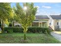 Charming home with a neatly landscaped front yard and welcoming front porch view at 204 Heck St, Raleigh, NC 27601