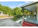View of the front yard showing the accessibility ramp leading to the covered porch at 204 Heck St, Raleigh, NC 27601