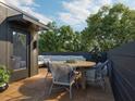 Relax on your rooftop deck, complete with stylish outdoor furniture, and perfect for entertaining friends and Gathering at 208 Byrum St # 5, Cary, NC 27511