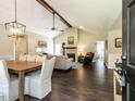 Open living room with vaulted ceilings, dark wood floors, and a fireplace at 235 Stephenson Rd, Benson, NC 27504