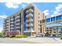 Modern building exterior with private balconies, pedestrian bridge and attractive landscaping at 2410 Environ Way, Chapel Hill, NC 27517