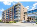 Modern condo building with balconies and large windows, showcasing a contemporary urban lifestyle at 2410 Environ Way, Chapel Hill, NC 27517