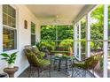 Inviting screened porch with comfortable seating and serene outdoor view at 2725 Bedford Ave, Raleigh, NC 27607